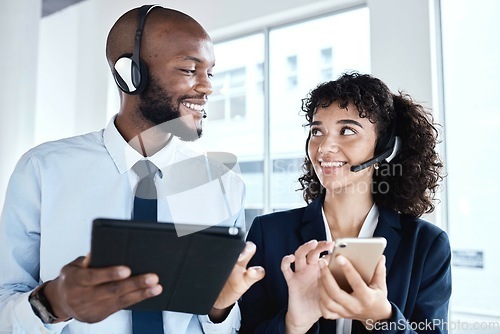 Image of Call center employees, contact us and technology with team, tablet and smartphone with communication. CRM, customer service or tech support with telemarketing, black man and woman with teamwork