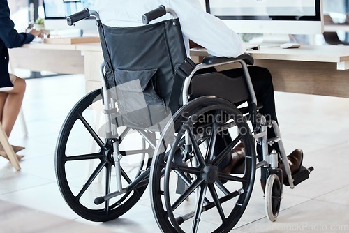 Image of Wheelchair, office and business man disability in the workplace doing administrative assistant work. Working, computer and desk job of a worker back with technology in a coworking space with staff