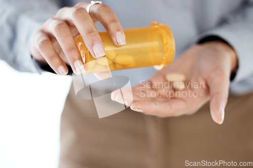 Image of Closeup, hands and pills for depression, stress and medication for cure, diagnosis and treatment. Zoom, female patient and lady with orange container, medicine or prescription for illness or sickness