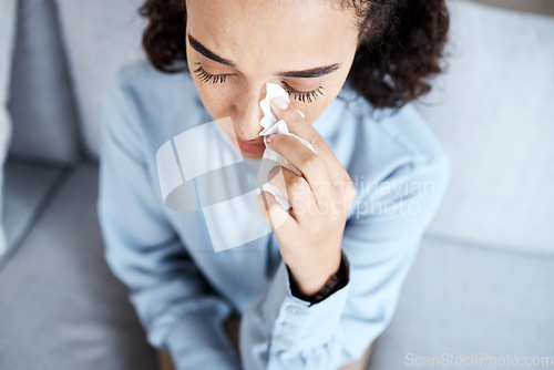 Image of Psychology, sad and woman crying with a tissue at a session for grief, depression or mental health. Psychiatry, depressed and lady emotional at a psychotherapy session sitting on a sofa in the office