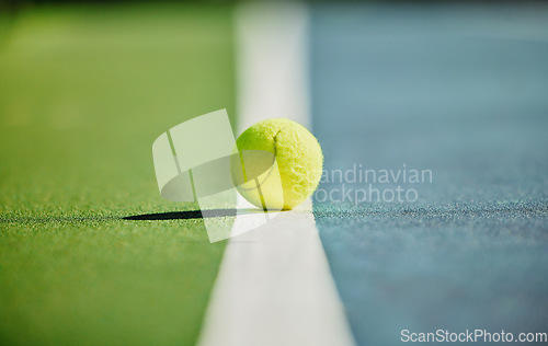 Image of Tennis ball, court and green texture of line between grass and turf game with no people. Sports, empty sport training ground and object zoom for workout, exercise and fitness for a match outdoor