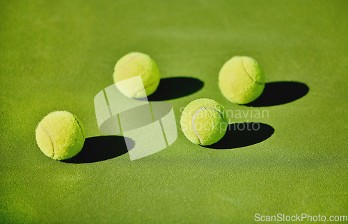 Image of Ball, tennis and outdoor court for a game, fitness and training for sports at a stadium. Shadow, start and equipment for a sport on the ground in a pattern for action, cardio and competition