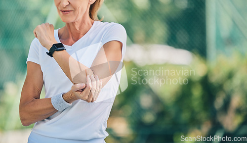 Image of Fitness, arm pain and tennis training with a mature woman on a outdoor court with mockup and injury. Fitness, wellness and workout inflammation of a athlete with joint and muscle problem from sport