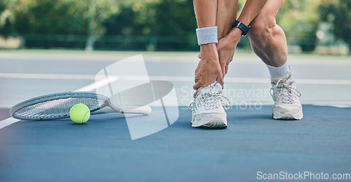 Image of Tennis player or woman with ankle pain on sports ground for healthcare risk, muscle accident or training problem. Competition, game and athlete on fitness court with foot injury and legs massage