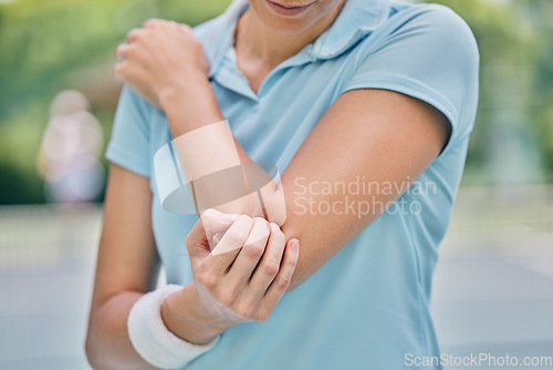 Image of Sports, woman and injury with elbow, pain and muscle strain while training, workout and outdoor fitness. Female, lady and athlete with emergency for arm, inflammation and broken bone while on court