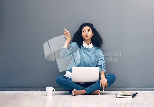 Image of Laptop, research and pointing with black woman on floor with mockup for social media, news or deal. Offer, online shopping and technology with girl customer for communication, internet or advertising