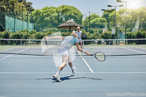Image of Sports, tennis and women playing a match for workout, fun or training on an outdoor court. Fitness, athletes and healthy girls practicing or doing a exercise for a game or competition at a stadium.