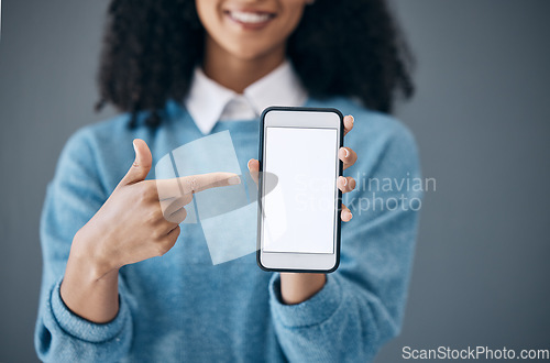 Image of Mockup screen, phone or black woman pointing hand at digital marketing, branding or advertising content. Startup, web or girl in studio with smartphone for product space, internet or social media