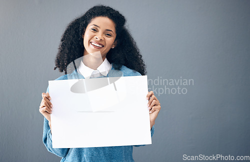 Image of Portrait, poster and black woman with billboard for space, advertising and branding on grey background. Face, blank sign or banner by girl relax on mock up, copy or announcement on product placement