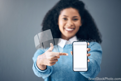Image of Mockup, phone screen or black woman pointing hand at digital marketing, branding or advertising content. Startup, web or girl in studio with smartphone for product space, internet or social media