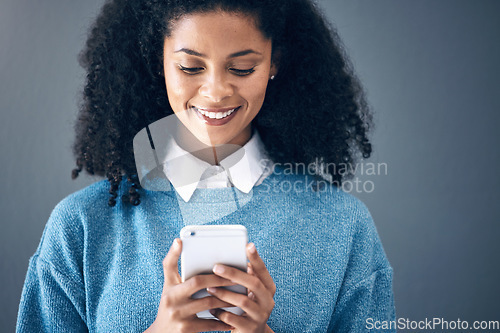 Image of Phone, mockup and black woman in studio for internet, search or social media on grey background. Online, communication and girl texting on space, smartphone or copy space for website, app or reading