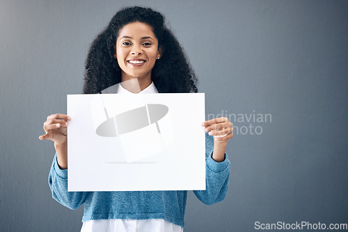 Image of Portrait, mockup and black woman with poster for space, advertising and branding on grey background. Face, blank or billboard sign by girl relax on mock up, copy or announcement on product placement