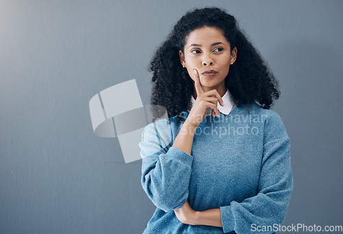 Image of Thinking, thoughtful and woman in a studio with an idea, smart question or plan in her head. Contemplating, pensive and doubtful female model from Mexico isolated by gray background with mockup space