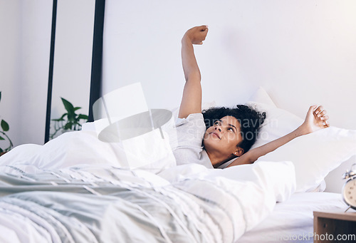 Image of Morning stretch, wake up and black woman in bed with peace feeling relax in a bedroom. Home, day start and calm young person in a house stretching arms on a lazy weekend ready for sleep or nap