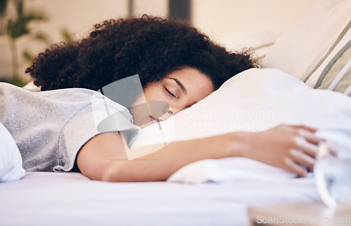 Image of Black woman, sleeping and bed in morning for peace, quiet and rest or relax in home bedroom. Person with pillow to dream or for calm sleep with insomnia or fatigue therapy for health and wellness