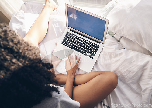 Image of Top view, bed and woman browsing on a laptop for social media or the internet in the morning. Technology, bedroom and female remote freelancer working on a freelance project on a computer at home.