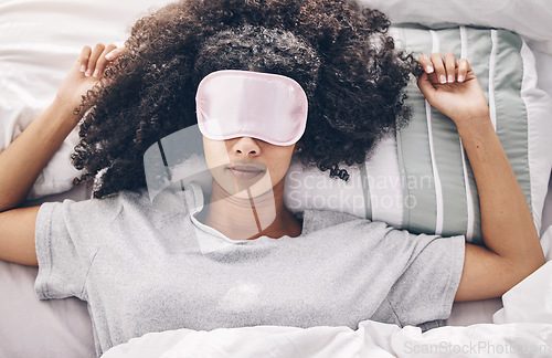 Image of Sleep, relax and black woman in bed with eye mask, dream and rejuvenate body and mind in apartment or hotel. Dreaming, rest and relaxation, tired girl sleeping late on weekend morning in cozy bedroom