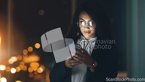 Image of Email, night and woman reading on a phone, communication and internet for business. Connection, social media and employee with a mobile in a dark office for the web, networking and overtime schedule