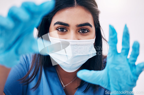 Image of Woman, doctor and hands with face mask for healthcare, exam or busy with surgery at the hospital. Female medical expert, surgeon or nurse with latex gloves ready for checkup or examination at clinic