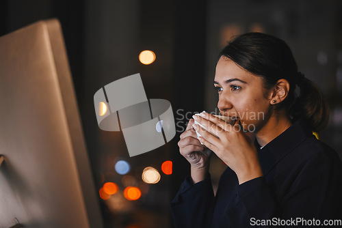 Image of Coffee, computer and night with a business woman in the office, working overtime late for a deadline. Research, thinking and caffeine with a dedicated female employee at work on a global project