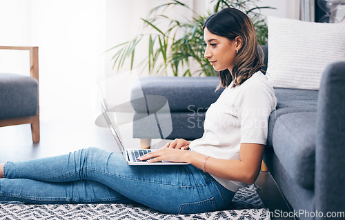 Image of Entrepreneur, woman on floor and laptop in living room, typing and connection for social media, break and relax. Business owner, female and girl with device, digital planning or in lounge for comfort