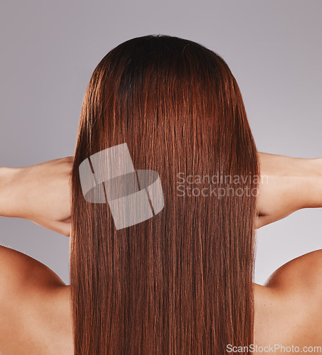 Image of Hair care, keratin and back of a woman for a salon isolated on a grey studio background. Beauty, strong and girl showing growth, shine and clean straight hairstyle from shampoo on a backdrop