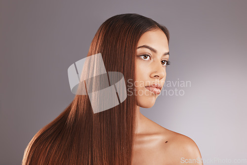 Image of Face, beauty and hair with a model black woman in studio on a gray background for natural treatment. Aestehtic, salon and haircare with an attractive young female posing to promote keratin benefits