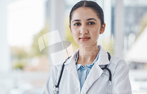 Image of Leader, female and portrait of a doctor in the hospital after a healthcare consultation. Confident, young and proud professional woman medical worker standing in a medicare clinic after a checkup.