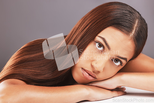 Image of Portrait, beauty and hair with a model black woman in studio on a gray background for keratin treatment. Face, natural or haircare with an attractive young female indoor to promote a grooming product