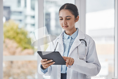 Image of Healthcare, research and doctor on tablet for medical report, test results and online consultation. Insurance, technology and woman health worker with digital tech for patient telehealth in hospital