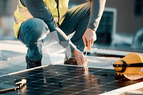 Image of Solar panel, screwdriver and industrial worker hands with tools for renewable energy and electricity. Community innovation, roof work and engineering install a eco friendly and sustainability product
