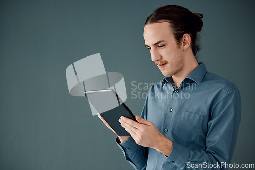 Image of Digital tablet, mockup and man in studio on internet, search or communication advertising on black background. App, website and businessman online schedule, planning and project, isolated and space