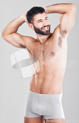 Image of Strong man, body and fitness with underwear for exercise, weight loss and wellness on studio background. Happy aesthetic person for health, motivation and stomach or muscle growth on healthy diet