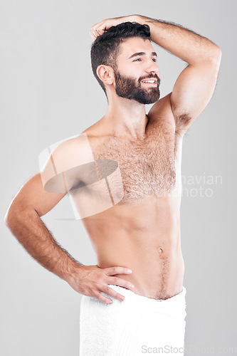 Image of Health, skincare and shower, man with towel, grooming or bathroom routine with muscular body care in studio. Spa, wellness and cleaning skin treatment for fit male model isolated on grey background.