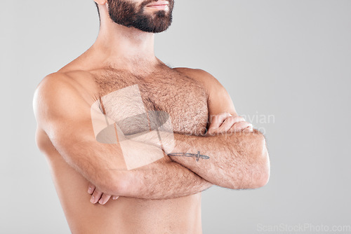 Image of Man, fitness body and arms crossed in studio isolated on a gray background. Sports health, training and bodybuilder with strong muscles after exercise, workout or bodybuilding for strength and power.