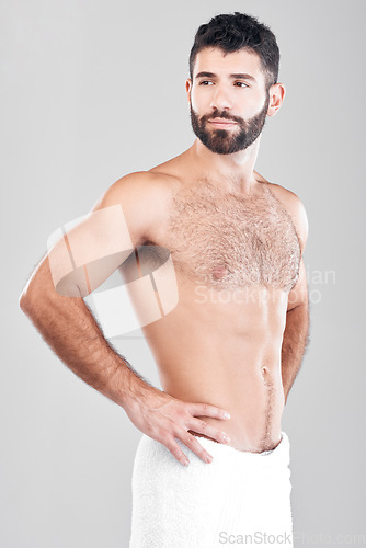 Image of Health, skincare and grooming, man with towel after shower or bathroom routine with muscular body care in studio. Spa, wellness and cleaning skin treatment for male model isolated on grey background.