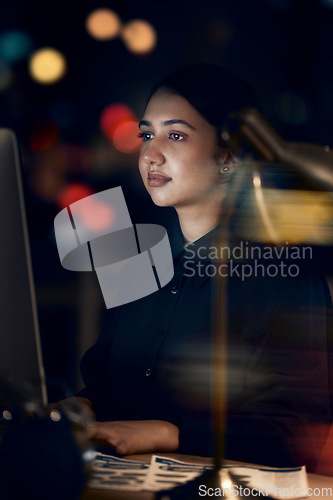 Image of Woman, night office and working at computer for seo planning, pc research or business in dark. Female worker, desktop technology and overtime with online network, data analytics and internet website