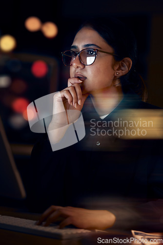 Image of Woman, night office and thinking at computer for seo planning, pc research or ideas in dark. Female worker, desktop technology and overtime with online network, data solution and internet strategy