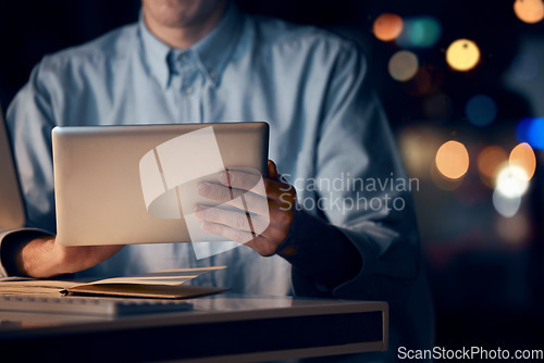 Image of Hands, tablet and business man in office working late on project, email or research at night. Bokeh, technology and male employee with digital touchscreen for networking, social media or web browsing