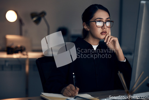 Image of Woman, night office and writing at computer for seo planning, research or agenda in dark startup. Female working overtime on desktop technology, online notes and network data for internet analytics