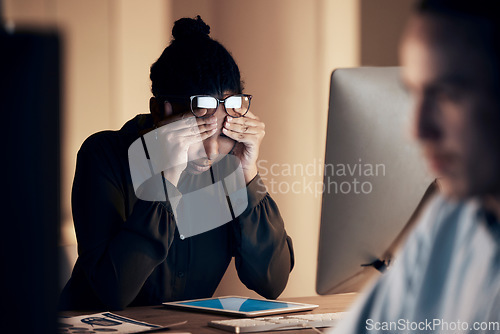 Image of Stress, headache and business black woman at night working on project, report and strategy deadline. Burnout, fatigue and female worker on computer in dark office frustrated, tired and overworked