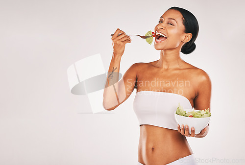 Image of Health, eating or woman with a salad in studio for a healthy meal, nutrition diet or digestion benefits. Body goals, lose weight or happy hungry female model with food isolated on a white background