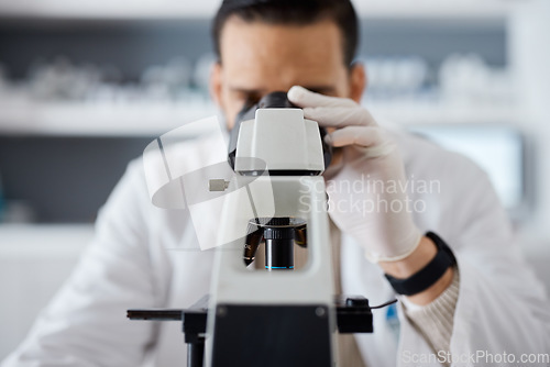 Image of Medical, microscope and research with a man scientist at work in a laboratory for innovation or development. Science, analytics and biotechnology with a male doctor working in a lab for breakthrough
