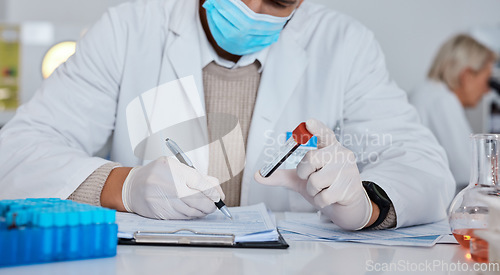 Image of Science, writing and man in laboratory with blood sample for dna results, medical report and research. Biotechnology, health and scientist write notes for data analytics, analysis and investigation