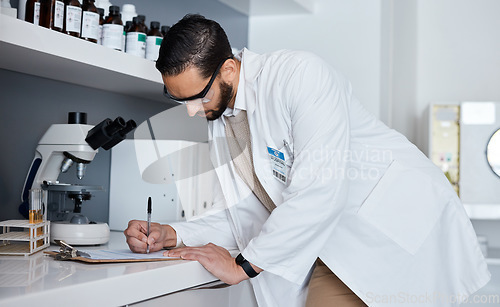 Image of Science, writing and man in laboratory for research, medical report and analytics on clipboard. Pharmaceutical medicine, healthcare and scientist write notes for data analysis, test results and study