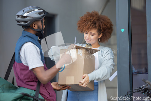 Image of Black man, box and customer signing in ecommerce for delivery service, package or order at door. Happy African American female with courier guy with signature on clipboard for quality or feedback