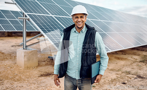 Image of Portrait, engineer and man outdoor, solar panels and hard hat for safety, happiness and plan for growth. Face, male employee or inspector with sustainability, outside or manager with renewable energy