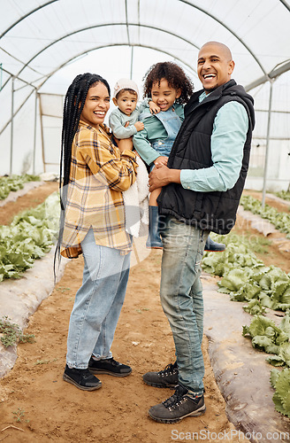 Image of Family, agriculture and parents with children in greenhouse for gardening, farming and harvest on farm. Sustainability, agro business and mom, dad and kids growing plants, vegetables and natural food