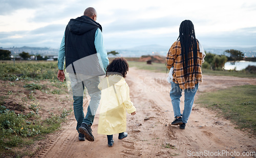 Image of Agriculture, farm and walking family with girl for quality time, adventure and bonding in countryside. Sustainability, farming and back of mom, dad and child ready for harvest, growth and gardening