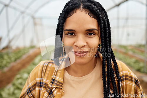 Image of Portrait, black woman and farmer face in greenhouse with agriculture, farming and sustainability with crop harvest. Environment, farm fresh vegetable produce with green and eco friendly production